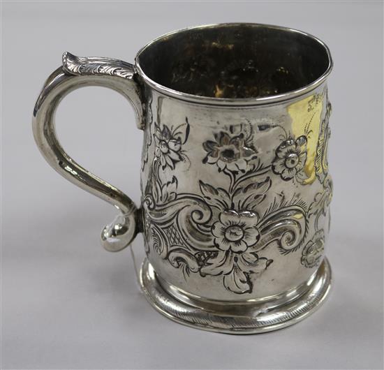 An early George II silver mug with later embossed decoration, Richard Gurney & Co, London, 1728, 11 oz.